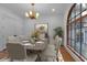Elegant dining room features a decorative chandelier, large windows, and seating for six at 89 Somerset Ln, Cartersville, GA 30121