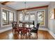 The formal dining room offers stunning views, hardwood floors, and stylish decor at 89 Somerset Ln, Cartersville, GA 30121