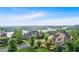 Stunning aerial view of an upscale neighborhood overlooking a pristine lake with lush greenery and luxury homes at 89 Somerset Ln, Cartersville, GA 30121