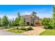 Stunning exterior view of a luxurious home with a circular driveway and beautiful landscaping at 89 Somerset Ln, Cartersville, GA 30121