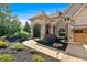 Beautiful home featuring an arched entryway, brick accents, siding, and lush landscaping at 89 Somerset Ln, Cartersville, GA 30121