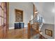 Elegant foyer with hardwood floors, staircase, and a console table with a large framed painting at 89 Somerset Ln, Cartersville, GA 30121