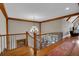Elegant foyer featuring hardwood floors, chandelier, and staircase with wrought iron railings at 89 Somerset Ln, Cartersville, GA 30121