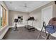 Home gym features rubber flooring, ceiling fan, and natural light at 89 Somerset Ln, Cartersville, GA 30121