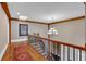 Hallway with wooden beam, stairs, and skylight at 89 Somerset Ln, Cartersville, GA 30121