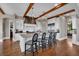 Elegant kitchen with granite countertops, stainless steel appliances, an island with seating, and hardwood floors at 89 Somerset Ln, Cartersville, GA 30121