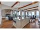 Open concept kitchen and living room boasts an island with seating and scenic views at 89 Somerset Ln, Cartersville, GA 30121