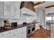 Gourmet kitchen featuring stainless steel appliances, custom cabinetry, and plenty of counter space for cooking prep at 89 Somerset Ln, Cartersville, GA 30121