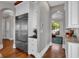 Modern kitchen with stainless steel appliances, white cabinetry and hardwood floors at 89 Somerset Ln, Cartersville, GA 30121
