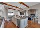 Bright kitchen features an island with seating, and an open floor plan flowing to the living room at 89 Somerset Ln, Cartersville, GA 30121