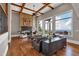Inviting living room with hardwood floors, stone fireplace, large windows with scenic views, and comfortable seating at 89 Somerset Ln, Cartersville, GA 30121