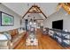 Spacious living room boasts hardwood floors, vaulted ceilings with wooden beams, and comfortable seating at 89 Somerset Ln, Cartersville, GA 30121