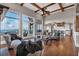 Open-concept living room with hardwood floors, high ceilings, a wall of windows, and an adjoining kitchen at 89 Somerset Ln, Cartersville, GA 30121
