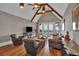 Living room with vaulted ceilings, hardwood floors, view to the outdoors, and giraffe at 89 Somerset Ln, Cartersville, GA 30121