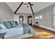 Spacious main bedroom with vaulted ceiling, large windows, hardwood floors, and a view at 89 Somerset Ln, Cartersville, GA 30121