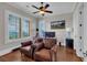 Bright office with views, hardwood floors, and comfortable seating makes working from home inviting at 89 Somerset Ln, Cartersville, GA 30121