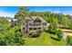 Spacious home features two decks, manicured lawn, lush landscaping and is surrounded by trees at 89 Somerset Ln, Cartersville, GA 30121