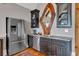 Modern wet bar featuring stainless steel appliances, granite countertops, and custom wood mirror at 89 Somerset Ln, Cartersville, GA 30121