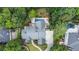 Aerial view of home featuring in ground pool, tennis court, lush backyard, and long driveway at 965 Tiverton Ln, Alpharetta, GA 30022