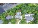 Stunning aerial view of a luxurious property nestled among lush trees near a tranquil lake at 965 Tiverton Ln, Alpharetta, GA 30022