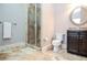 Bathroom features a tiled shower, a modern sink with vanity, and neutral tones for a spa-like feel at 965 Tiverton Ln, Alpharetta, GA 30022