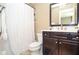 Modern bathroom with vanity, toilet, tiled shower and decorative accents at 965 Tiverton Ln, Alpharetta, GA 30022