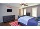 Inviting bedroom with hardwood floors, tv, windows, and a fan at 965 Tiverton Ln, Alpharetta, GA 30022