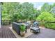 Outdoor deck with comfortable seating, ideal for relaxation and enjoying the surrounding lush greenery at 965 Tiverton Ln, Alpharetta, GA 30022