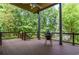 Enjoy outdoor cooking on this spacious covered deck with beautiful views of the surrounding landscape at 965 Tiverton Ln, Alpharetta, GA 30022