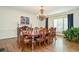 Spacious dining room with elegant chandelier and natural light at 965 Tiverton Ln, Alpharetta, GA 30022