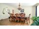 Formal dining room with chandelier and hardwood flooring at 965 Tiverton Ln, Alpharetta, GA 30022