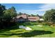 Aerial view of golf course home with lush green landscaping and scenic surroundings at 965 Tiverton Ln, Alpharetta, GA 30022