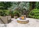 Cozy outdoor fire pit area with comfortable seating, ideal for gatherings and enjoying the ambiance at 965 Tiverton Ln, Alpharetta, GA 30022