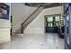 Grand foyer with staircase and tile flooring at 965 Tiverton Ln, Alpharetta, GA 30022