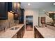 Modern kitchen features stainless steel appliances, granite countertops, and dark wood cabinetry at 965 Tiverton Ln, Alpharetta, GA 30022