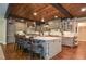 Gourmet kitchen features a wood plank ceiling, stainless appliances, and an expansive center island at 965 Tiverton Ln, Alpharetta, GA 30022