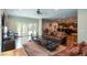 Bright living room with comfortable seating, hardwood floors, and a view of the open kitchen at 965 Tiverton Ln, Alpharetta, GA 30022