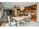 Open floorplan features a living room, kitchen, and dining area under a wood plank ceiling at 965 Tiverton Ln, Alpharetta, GA 30022