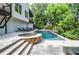 Backyard swimming pool and spa, perfect for relaxation and outdoor enjoyment amid lush landscaping at 965 Tiverton Ln, Alpharetta, GA 30022