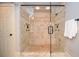 Contemporary tile shower with dual shower heads, glass door, and bench at 965 Tiverton Ln, Alpharetta, GA 30022