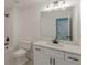 Bright bathroom features a shower and vanity with white cabinets and a large mirror at 4075 O Henry Ct, Mcdonough, GA 30252