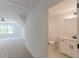 Bedroom leading into a bathroom with a white vanity, toilet, and walk in shower at 4075 O Henry Ct, Mcdonough, GA 30252