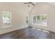 This bedroom features dark floors, high vaulted ceilings, multiple windows, and a ceiling fan at 4075 O Henry Ct, Mcdonough, GA 30252