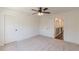 Spacious carpeted bedroom featuring white trim and doors leading to other areas of the home at 4075 O Henry Ct, Mcdonough, GA 30252