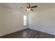 Bedroom with ceiling fan and a window, with dark hardwood floors at 4075 O Henry Ct, Mcdonough, GA 30252