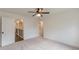 Bedroom featuring neutral carpeting, access to upstairs hallway and ceiling fan at 4075 O Henry Ct, Mcdonough, GA 30252