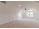 Bright bonus room featuring neutral carpeting, large windows and unique ceiling lines at 4075 O Henry Ct, Mcdonough, GA 30252