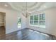 Bright dining room features wood floors, large windows, and decorative ceiling at 4075 O Henry Ct, Mcdonough, GA 30252