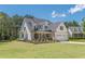 Charming two-story home with a brick and siding facade, well-manicured lawn, and a two-car garage at 4075 O Henry Ct, Mcdonough, GA 30252