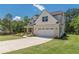 Charming two-story home with a brick and siding facade, well-manicured lawn, and a two-car garage at 4075 O Henry Ct, Mcdonough, GA 30252